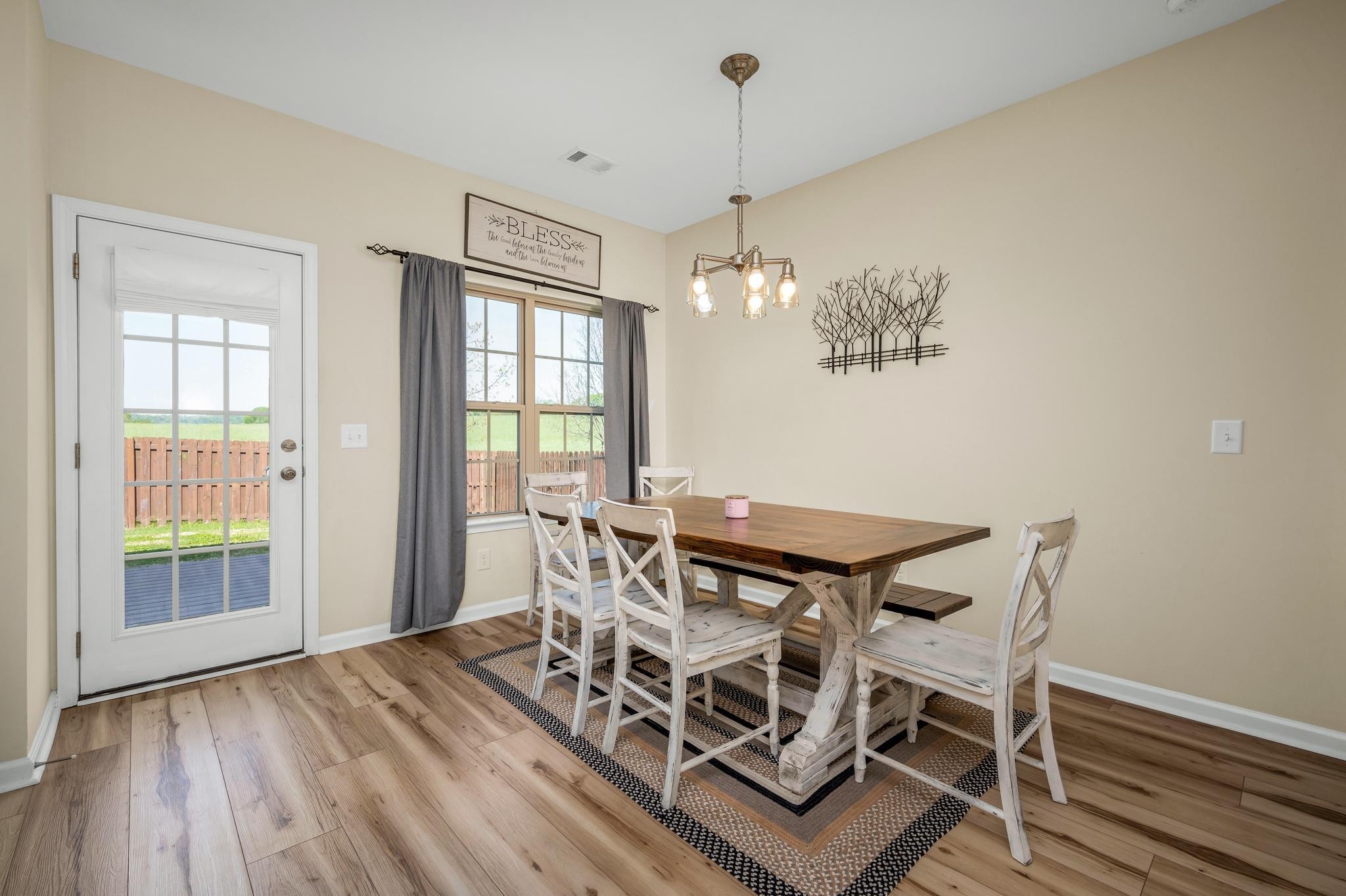 5003 Hemlock Court Spring Hill, TN 37174 - Photo 12 of 32 a view of a dining room with furniture wooden floor and chandelier