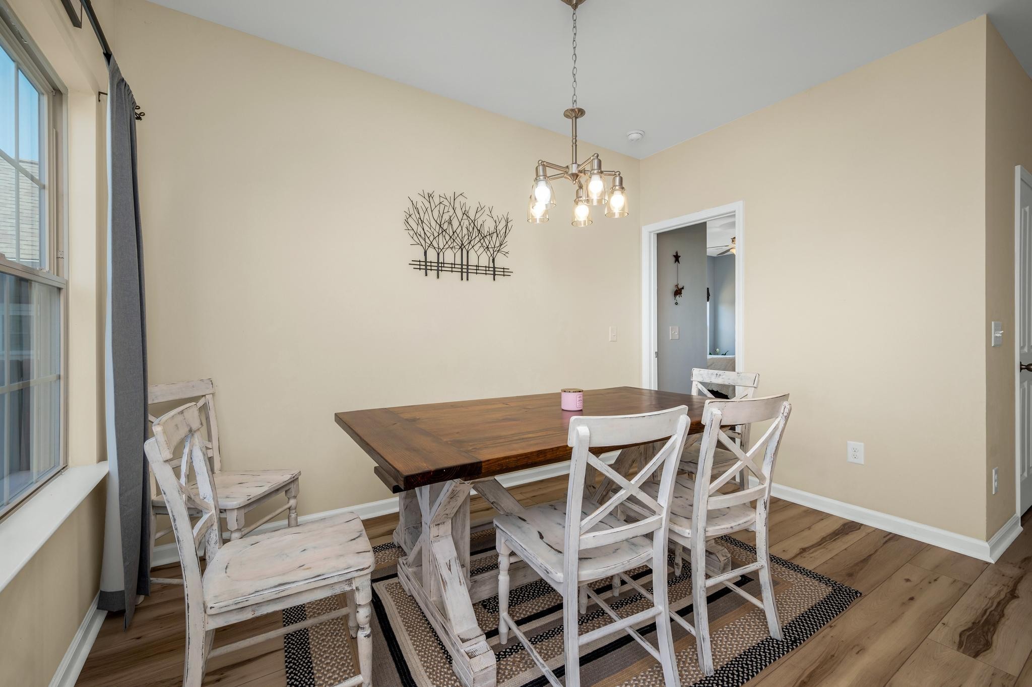 5003 Hemlock Court Spring Hill, TN 37174 - Photo 13 of 32 a view of a dining room with furniture wooden floor and a chandelier