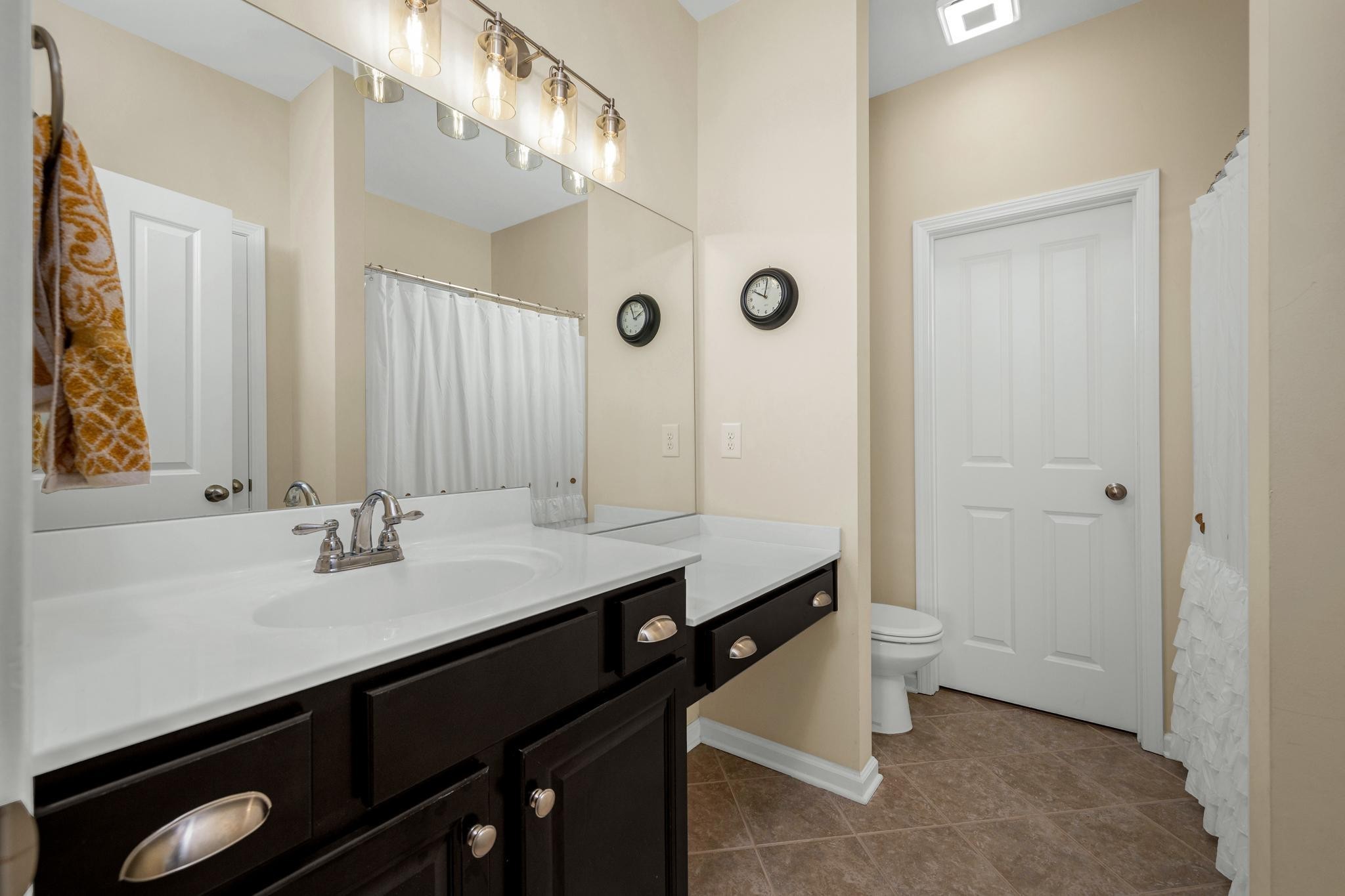 5003 Hemlock Court Spring Hill, TN 37174 - Photo 18 of 32 a bathroom with a sink double vanity and a mirror