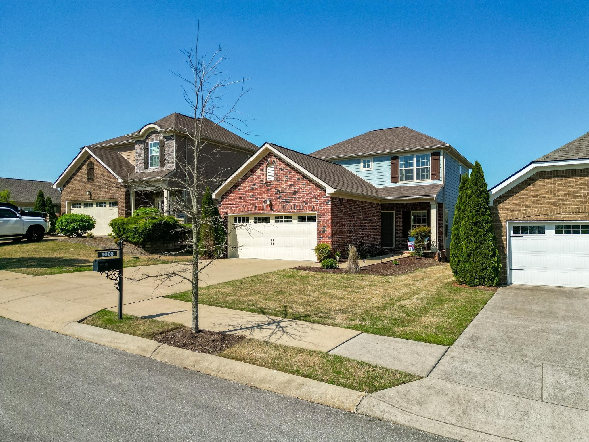 5003 Hemlock Court Spring Hill, TN 37174 - Photo 2 of 32 a front view of a house with garden