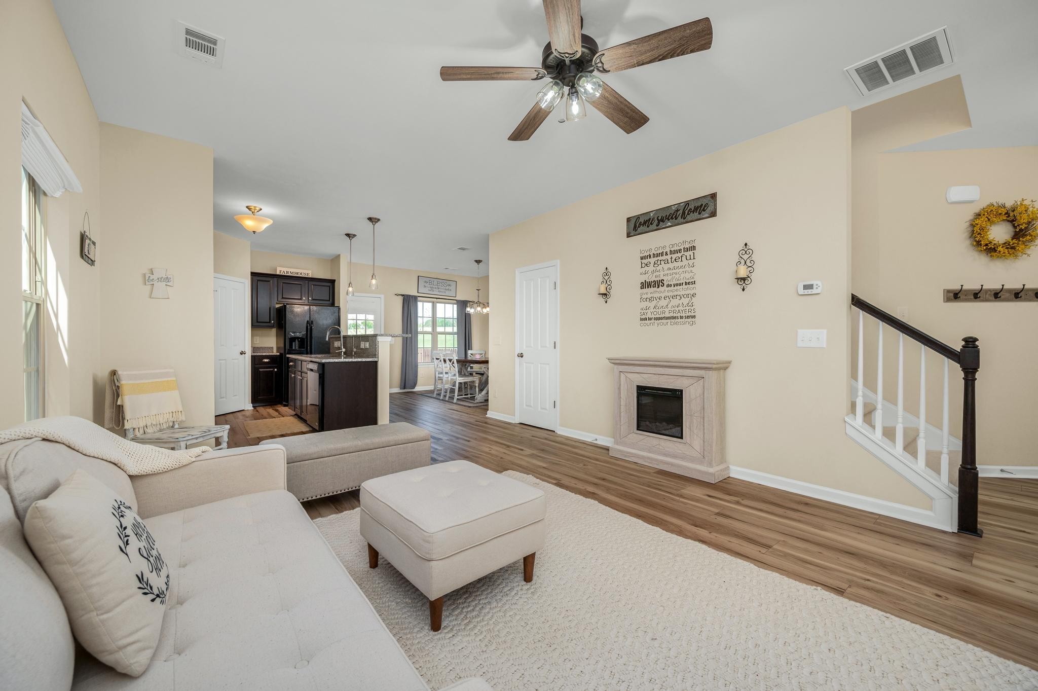 5003 Hemlock Court Spring Hill, TN 37174 - Photo 9 of 32 a living room with furniture a fireplace and a flat screen tv