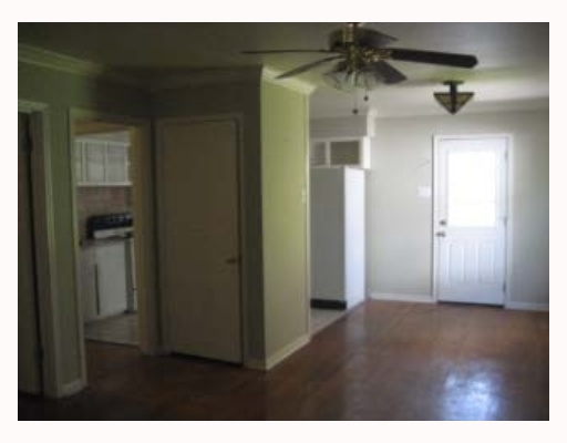 3929 Cott Street Corpus Christi, TX 78411 - Photo 3 of 10 a view of a hallway with wooden floor
