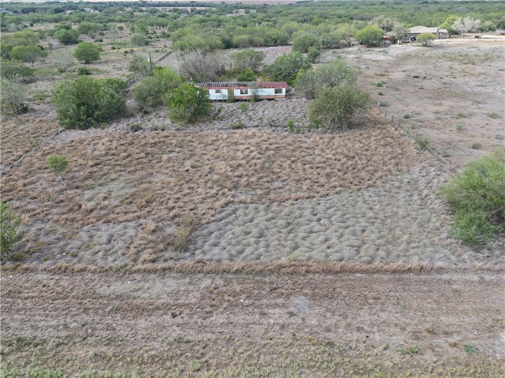 0 Fm Road Robstown, TX 78380 - Photo 11 of 20 a view of a dry yard with wooden fence