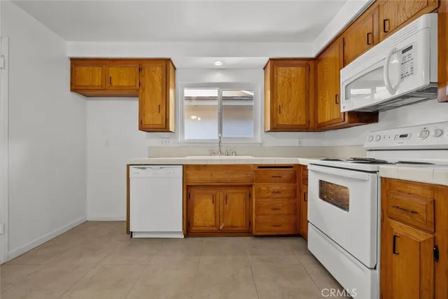 a kitchen with stainless steel appliances granite countertop a stove and a sink