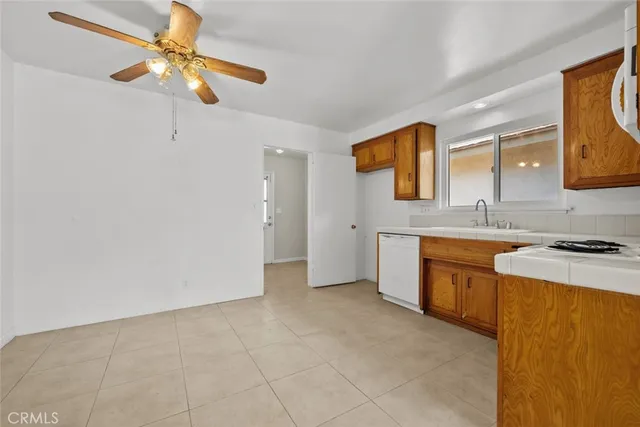 a kitchen with stainless steel appliances granite countertop a sink a stove top oven with a granite countertops