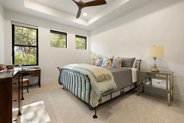 a bedroom with a bed and a table