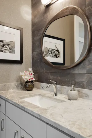 a bathroom with a sink and a mirror