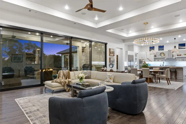 a view of a dining room kitchen with furniture and chandelier