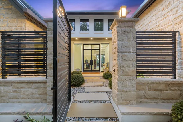 a view of a brick house with a large windows