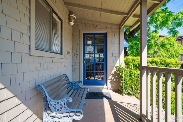 a view of a two chairs in the balcony
