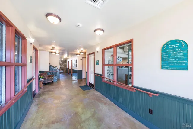 a view of a room with lots of windows