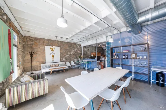 a dining room with furniture and a chandelier