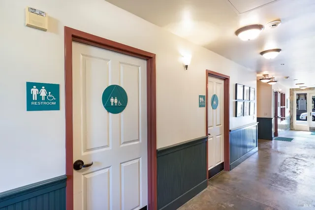 a view of a hallway view with wooden floor and staircase