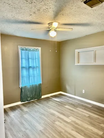a bathroom with a shower and a toilet