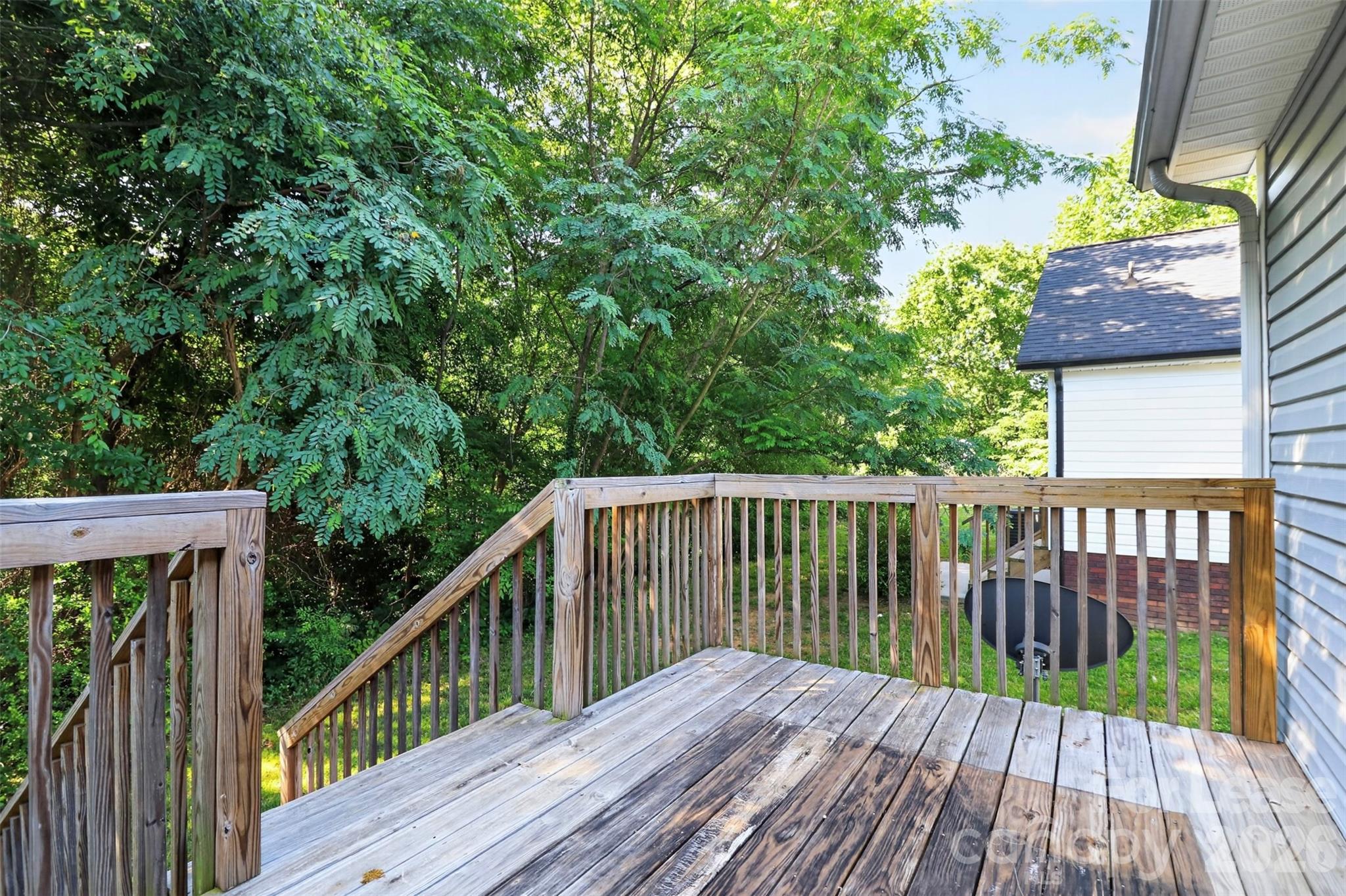 91-93 Sunderland Road Southwest, Unit 93 Concord, NC 28027 - Photo 29 of 30 a balcony with wooden floor and outdoor space