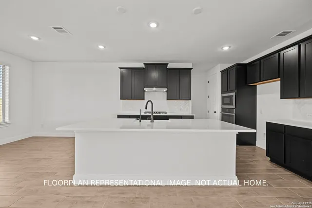 a spacious bathroom with a tub sink and mirror