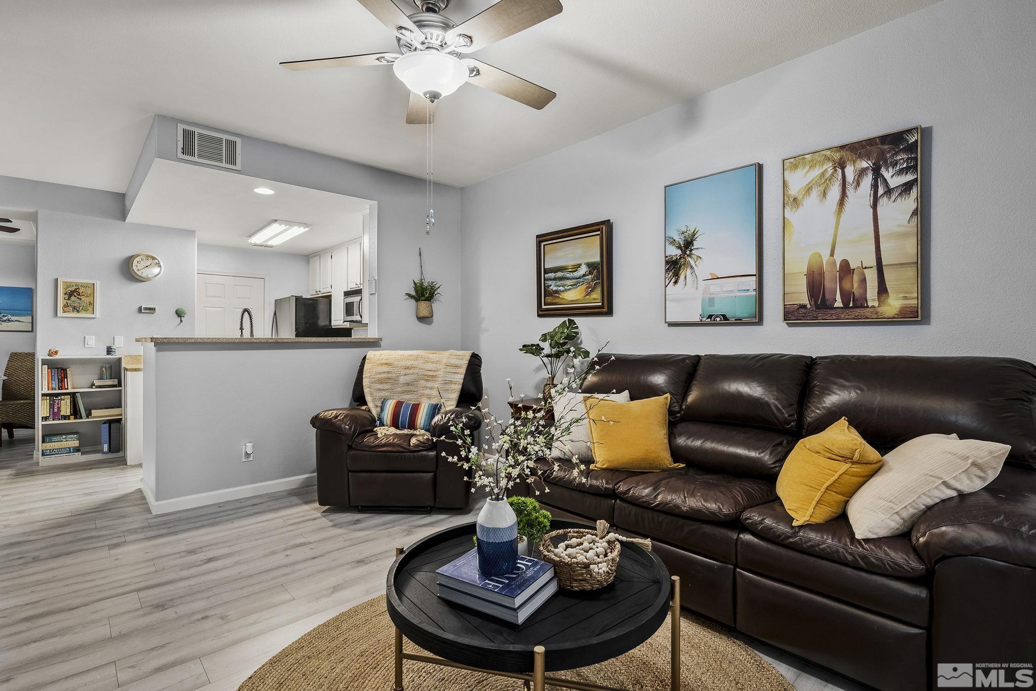 900 South Meadows Parkway, Unit 2012 Reno, NV 89521 - Photo 4 of 17 a living room with furniture and kitchen view