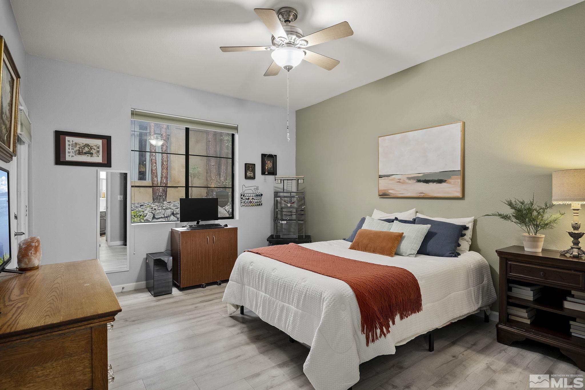 900 South Meadows Parkway, Unit 2012 Reno, NV 89521 - Photo 10 of 17 a bedroom with a bed and a desk