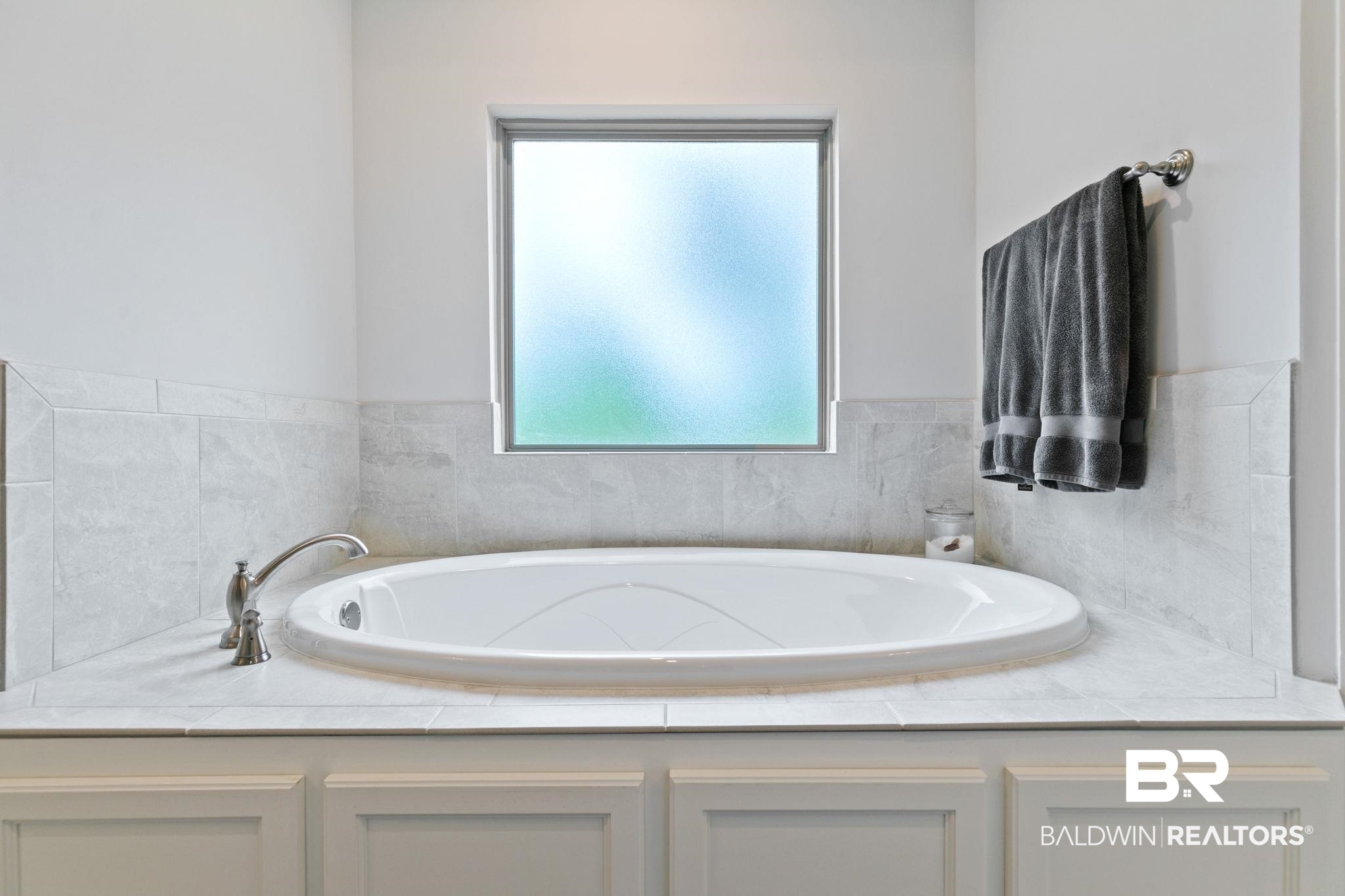 13233 Ibis Boulevard Daphne, AL 36527 - Photo 33 of 100 Built-in soaking tub with brushed nickel fixtures set within a tiled deck