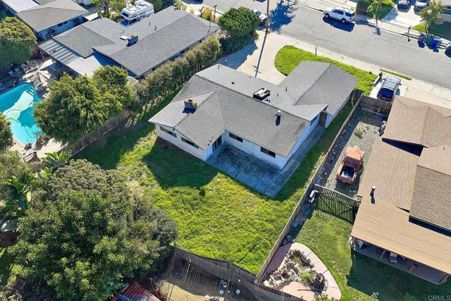 an aerial view of a house with a garden