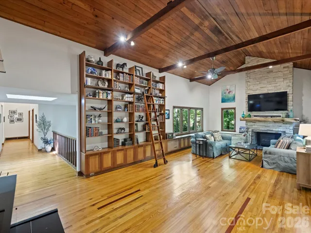 a view of a livingroom with furniture and a fireplace