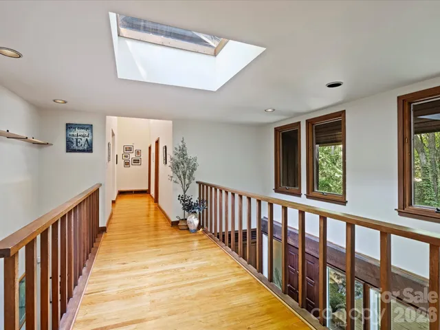 a bedroom with a large bed and a large window