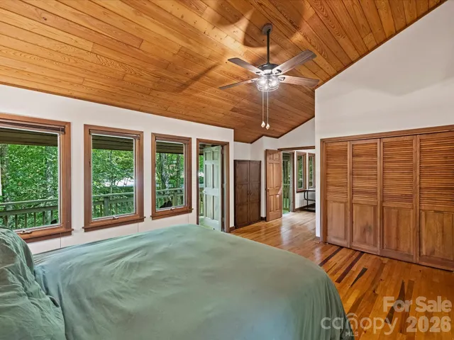 a bathroom with double vanity sinks a shower and a mirror