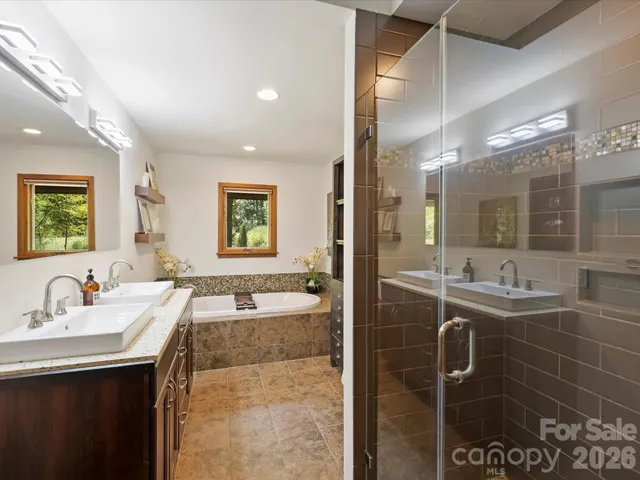 a bath tub sitting in a bathroom next to a sink