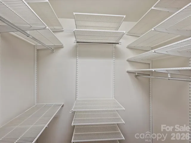 a view of balcony with wooden floor and fence