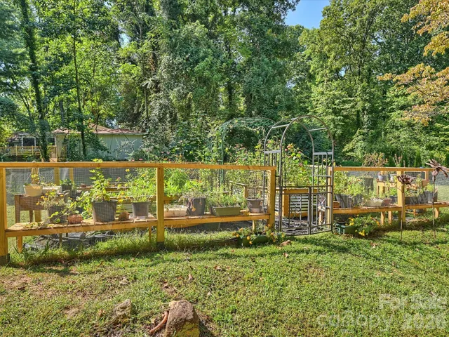 a view of a swimming pool with a yard