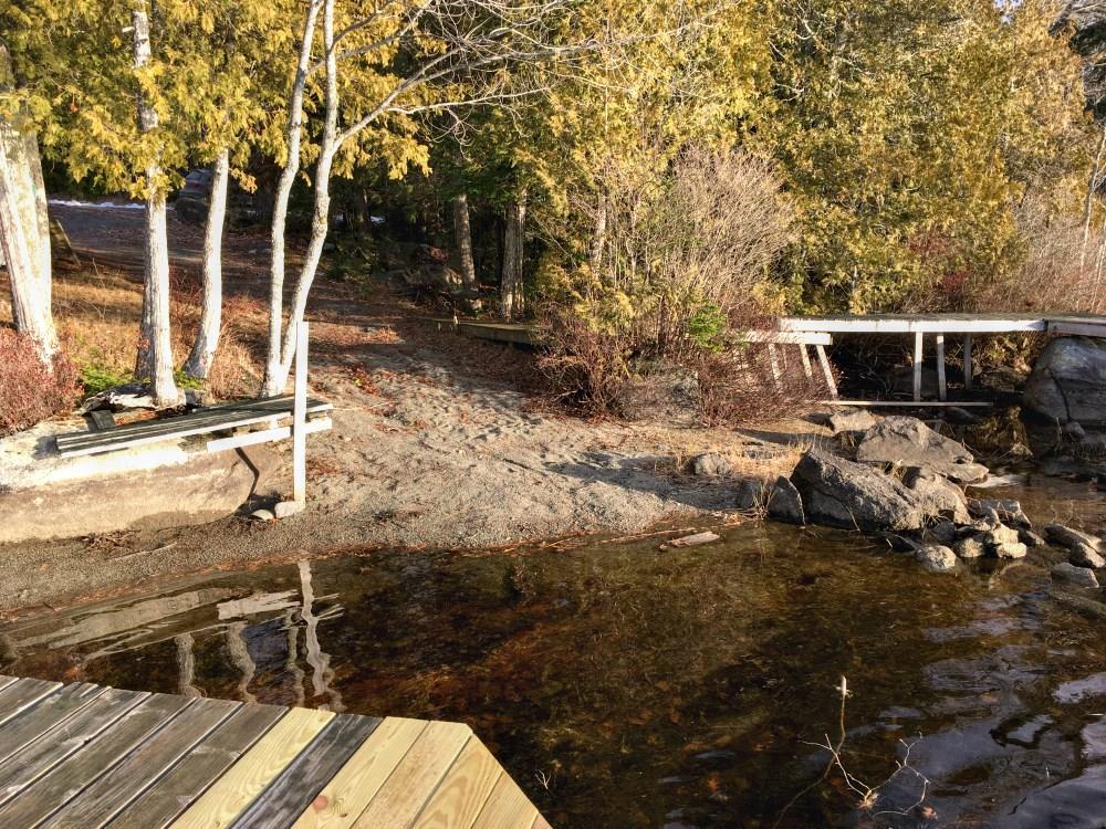 557 Phinney Farm Road Lincoln, ME 04457 - Photo 5 of 32 View of sandy beach from the dock.