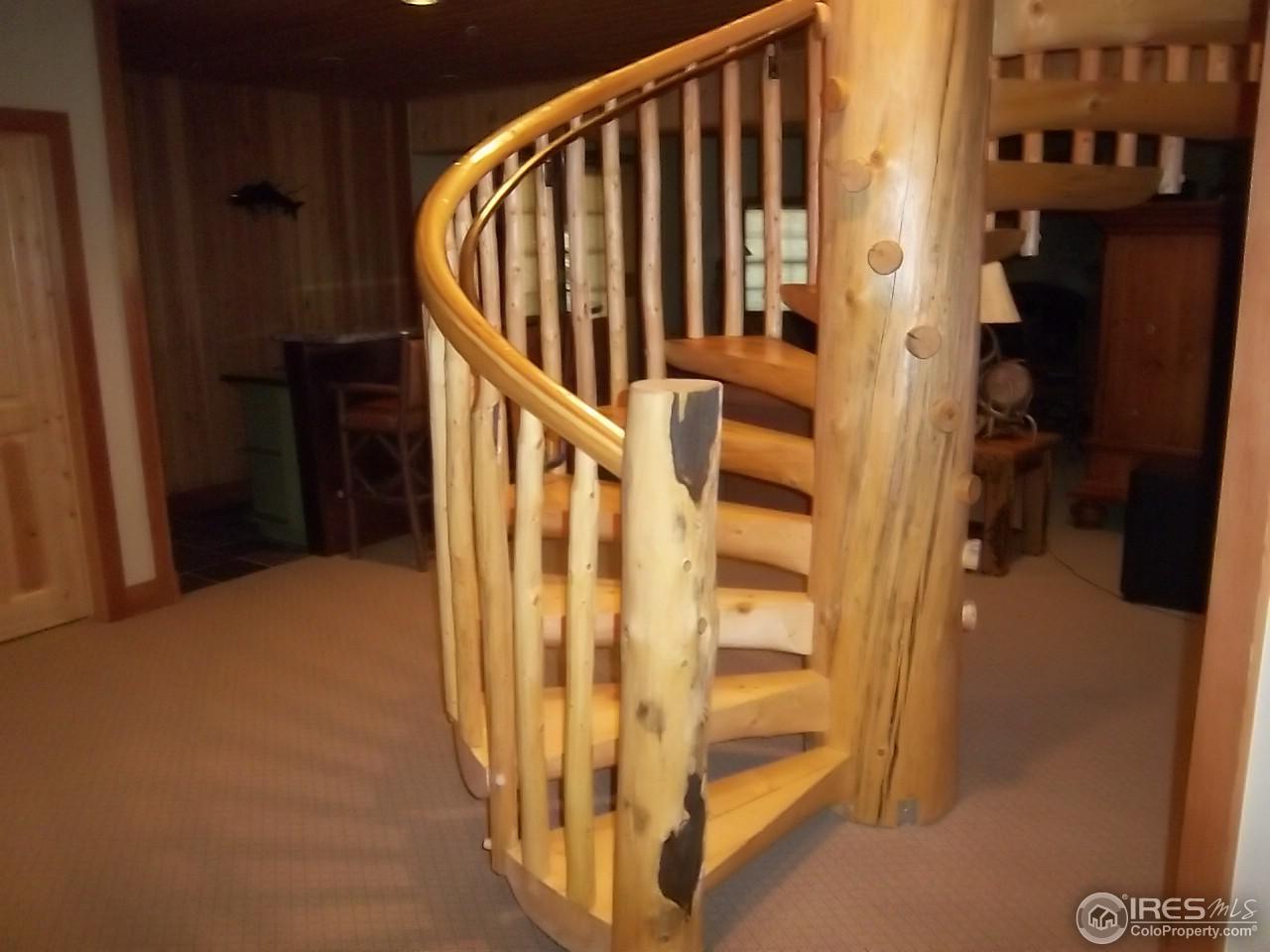 1455 Ridge Road Nederland, CO 80466 - Photo 24 of 40 a view of staircase with railing and white walls