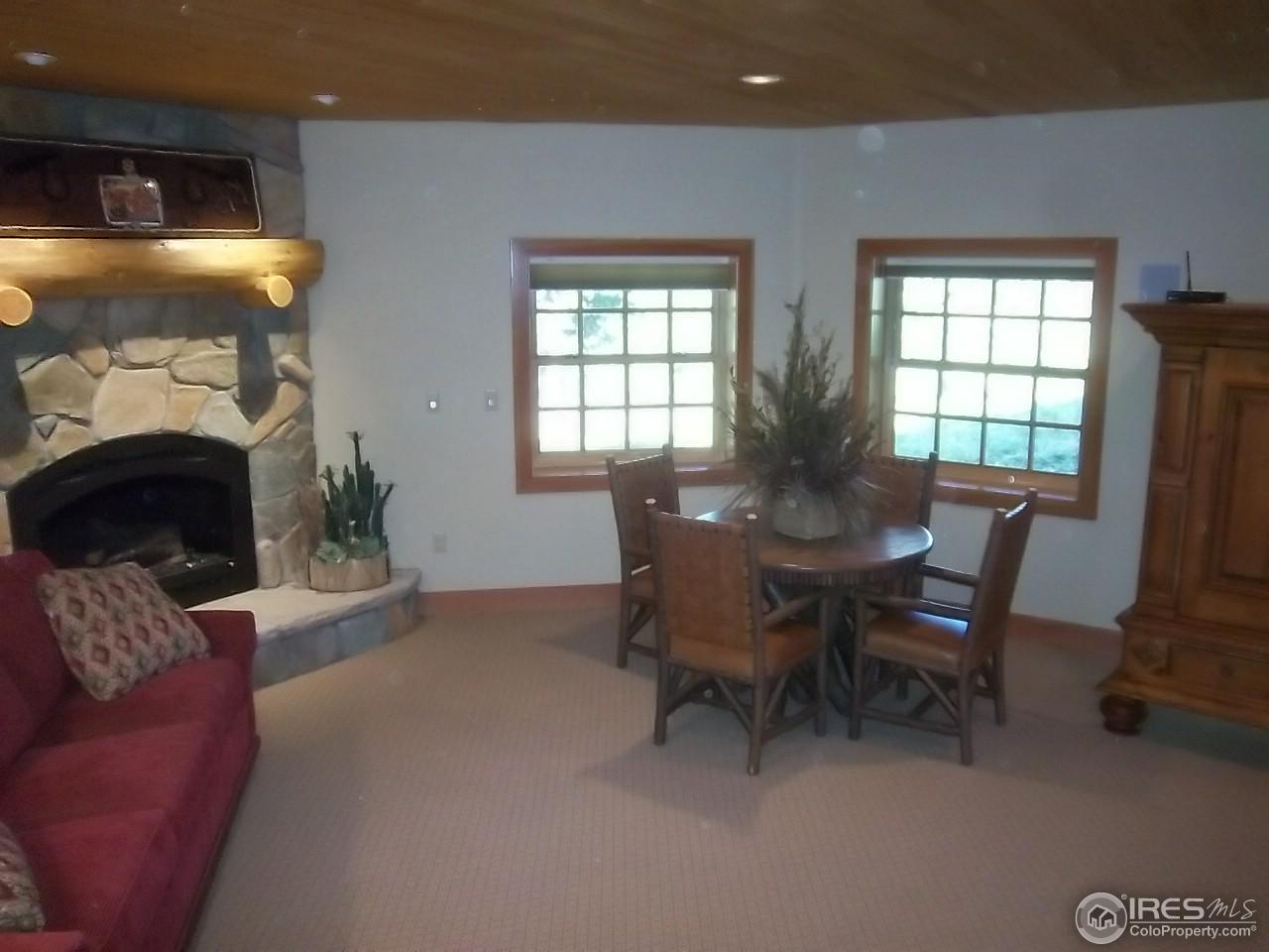 1455 Ridge Road Nederland, CO 80466 - Photo 33 of 40 a view of a dining room with furniture and a window