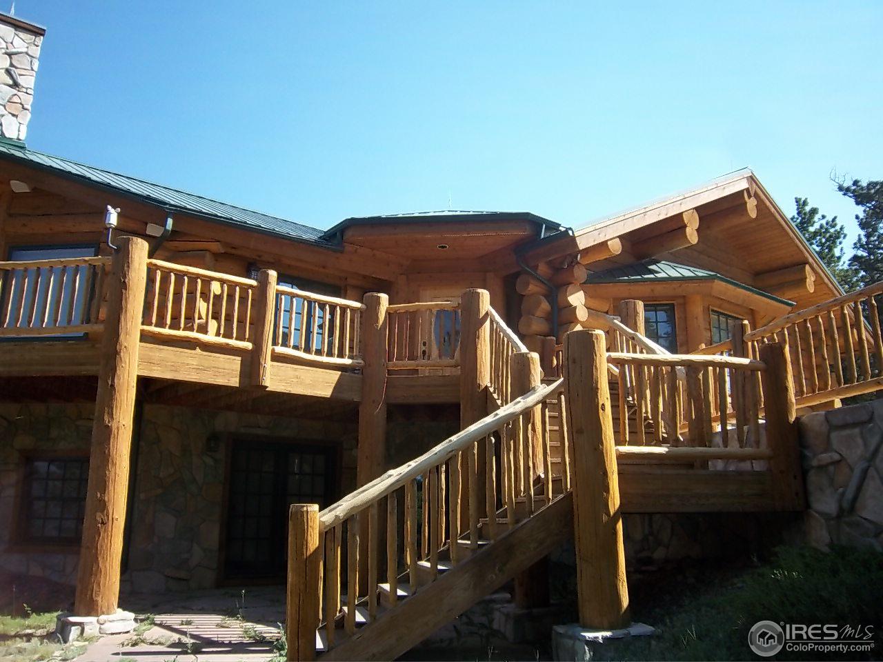 1455 Ridge Road Nederland, CO 80466 - Photo 4 of 40 a view of a house with wooden deck