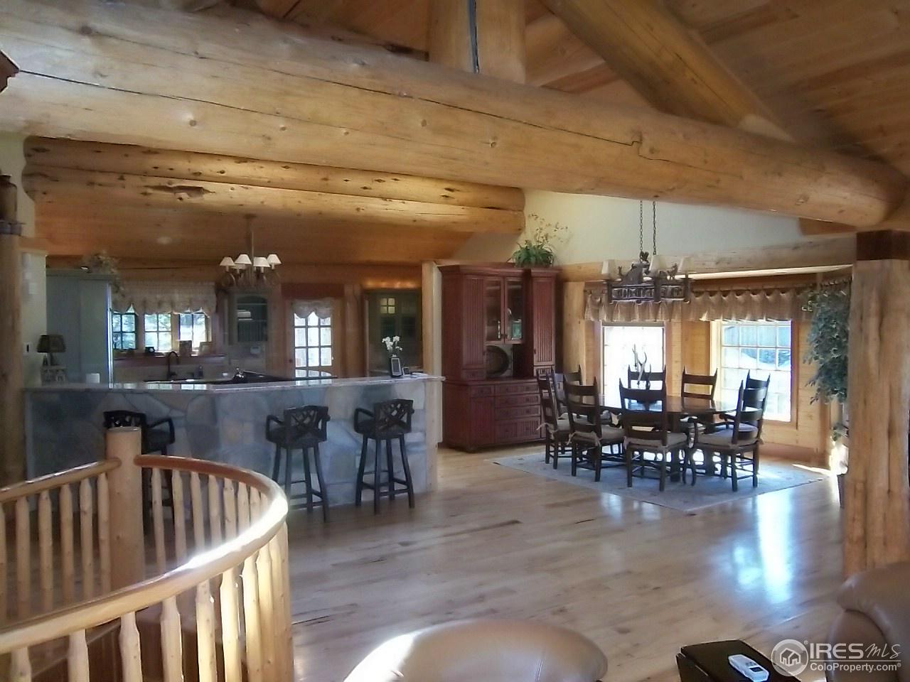 1455 Ridge Road Nederland, CO 80466 - Photo 7 of 40 a dining hall with lots of furniture and outdoor space