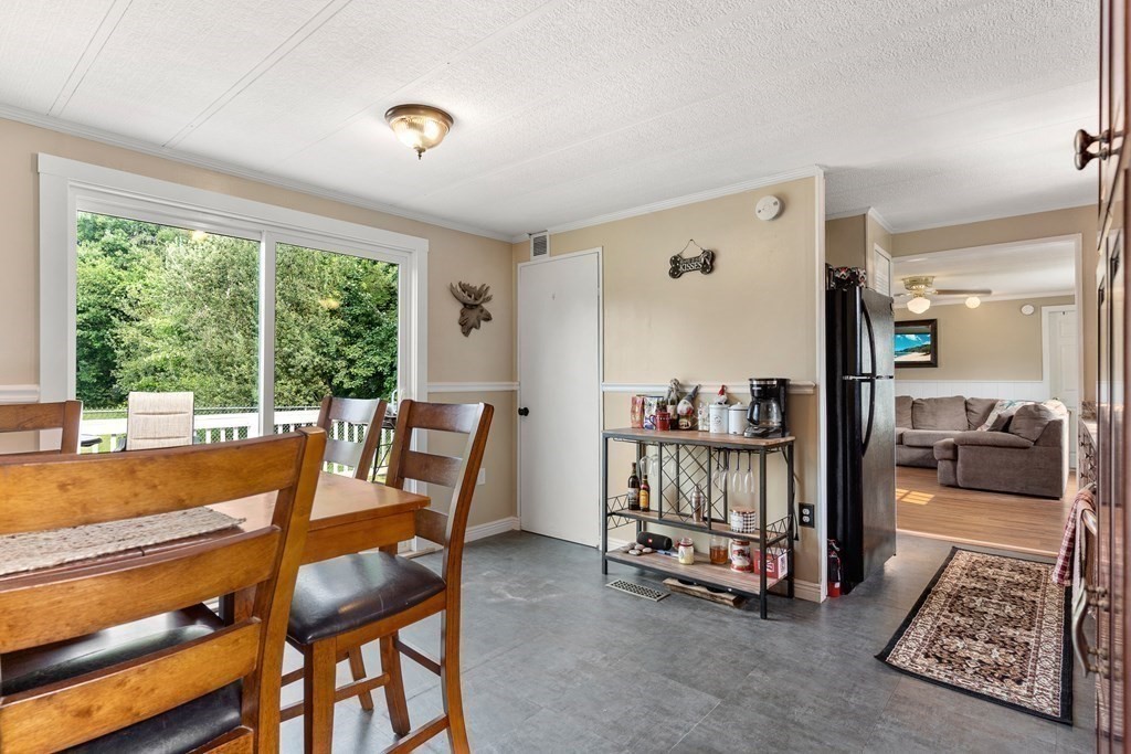 114 Lafayette Road Salisbury, MA 01952 - Photo 14 of 24 a dining room with furniture and a floor to ceiling window