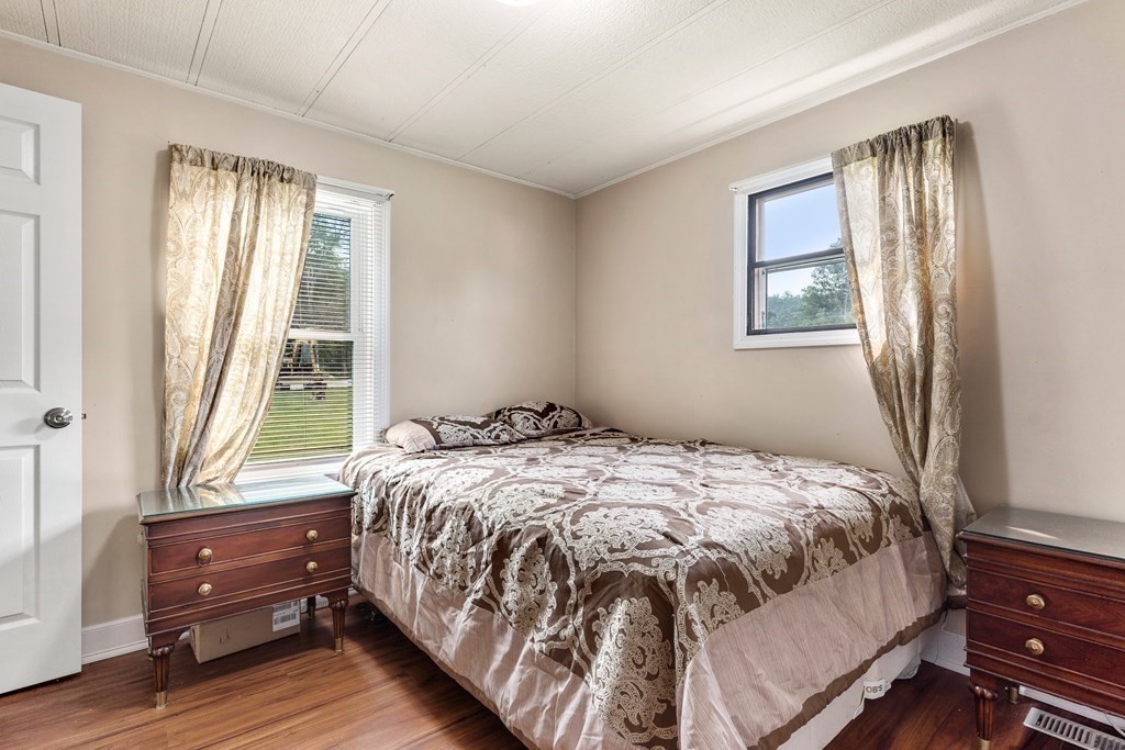 114 Lafayette Road Salisbury, MA 01952 - Photo 5 of 24 a bed sitting in a bedroom next to a window