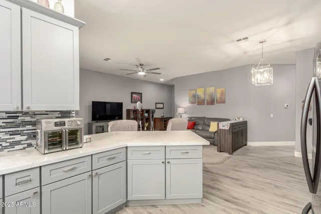 a kitchen with a sink and a refrigerator