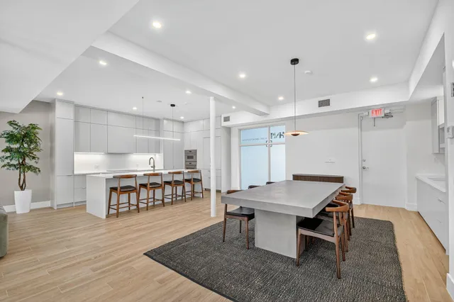 a kitchen with a table and chairs in it
