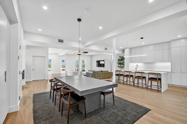 a open kitchen with a table and chairs in it