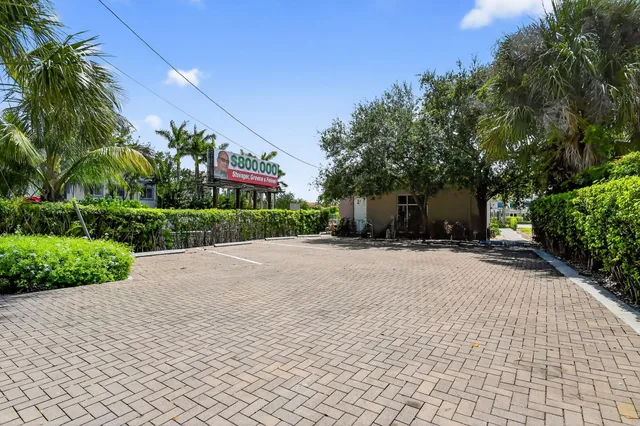 a front view of a building with a yard