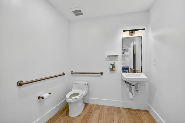 a bathroom with a toilet and a sink