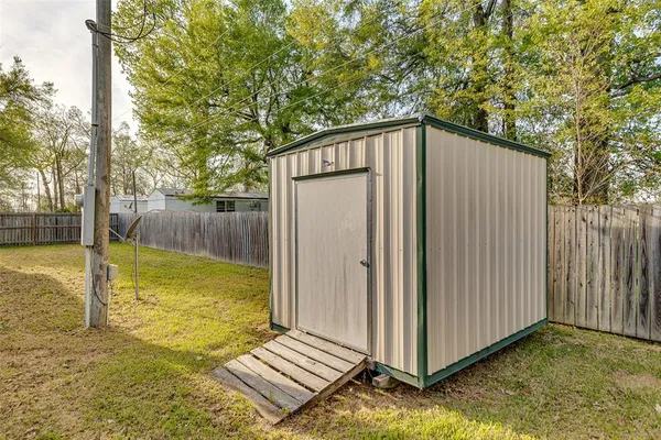 a view of a backyard with swimming pool