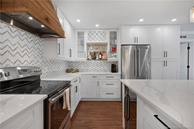 a kitchen with a sink stove and refrigerator