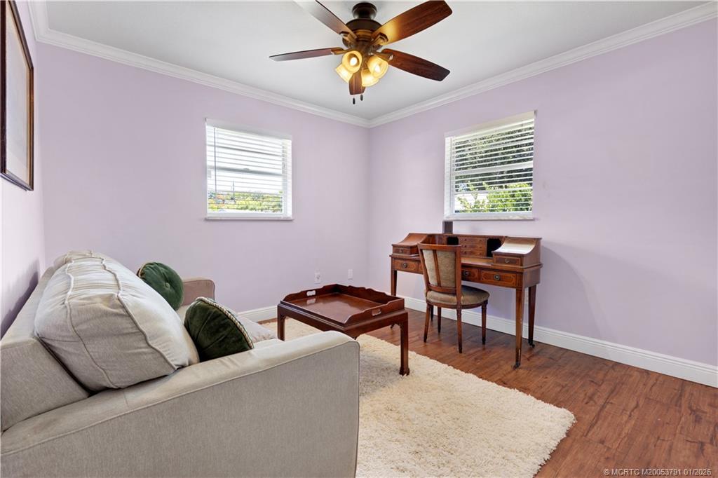 2916 Southeast Paramount Place Stuart, FL 34997 - Photo 27 of 38 a living room with furniture and a window