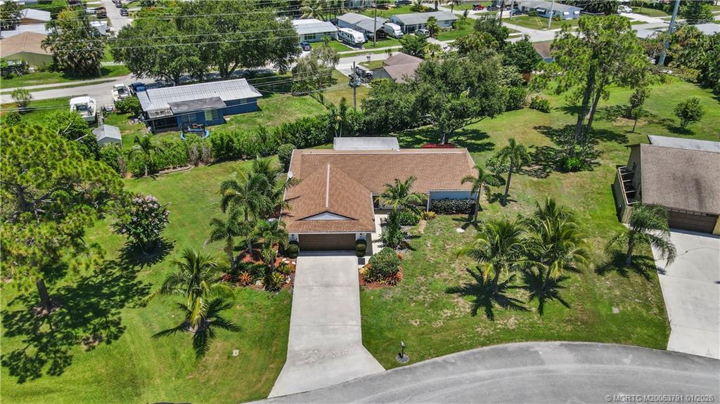 2916 Southeast Paramount Place Stuart, FL 34997 - Photo 33 of 38 an aerial view of a house with a yard