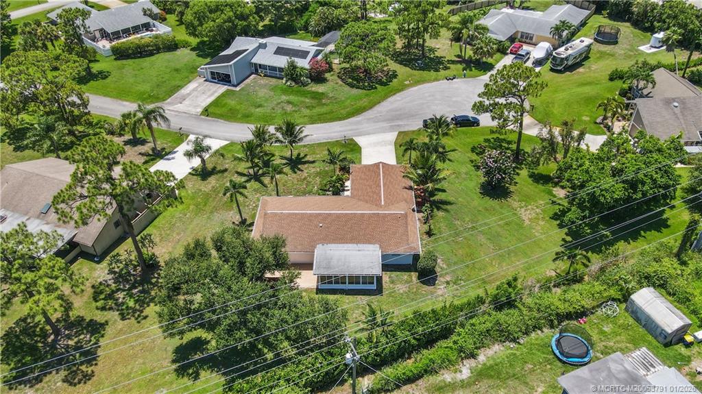 2916 Southeast Paramount Place Stuart, FL 34997 - Photo 34 of 38 an aerial view of a house with a yard and lake view