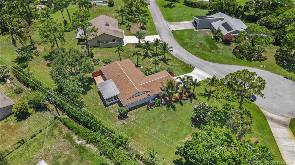 2916 Southeast Paramount Place Stuart, FL 34997 - Photo 35 of 38 an aerial view of residential house with outdoor space and trees all around