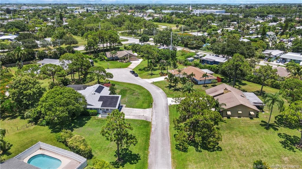 2916 Southeast Paramount Place Stuart, FL 34997 - Photo 37 of 38 an aerial view of residential houses with outdoor space and trees