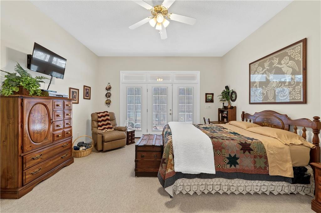 125 Lowe Road Northwest Milledgeville, GA 31061 - Photo 12 of 62 a bed room with a bed and a painting on the wall